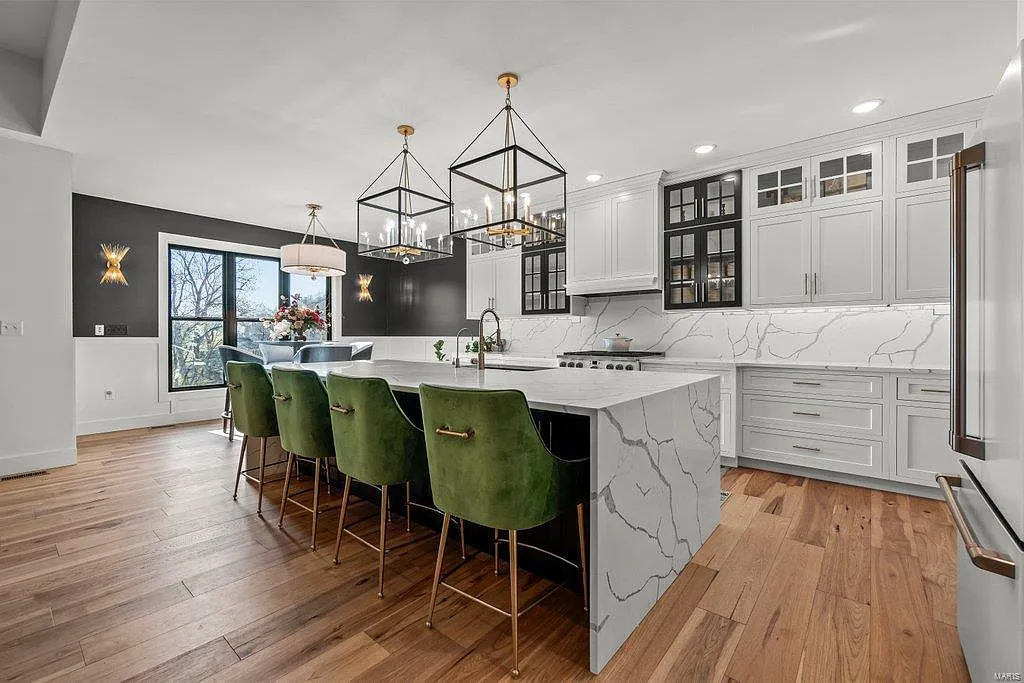a kitchen with a large island and a large island