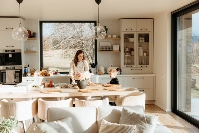 Bright kitchen with flowers and food.