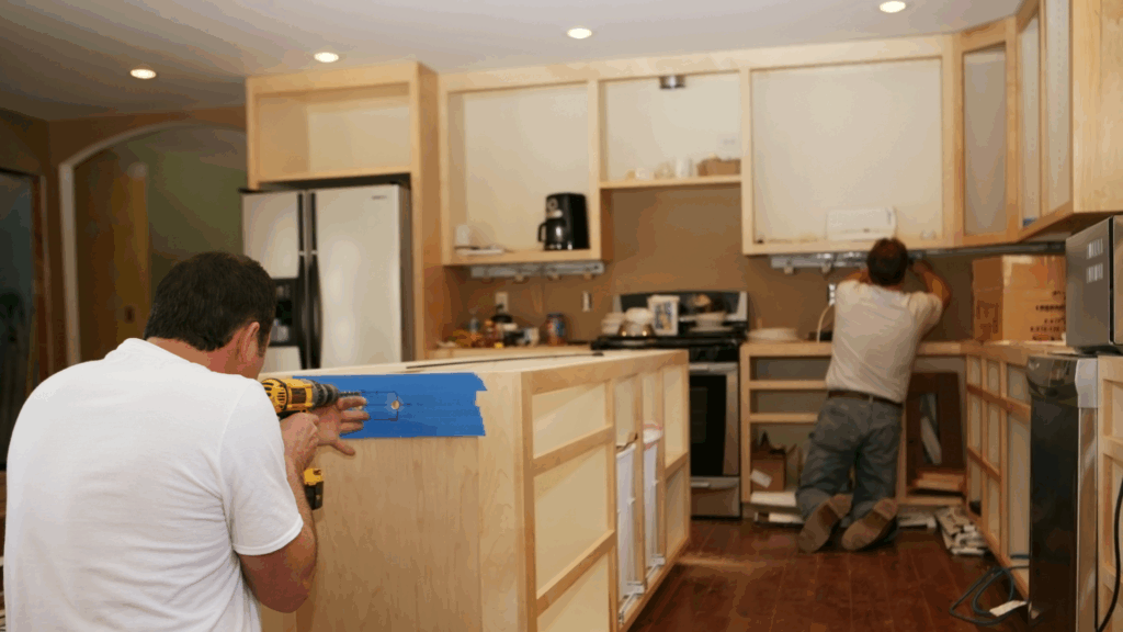 Two men working on kitchen renovation