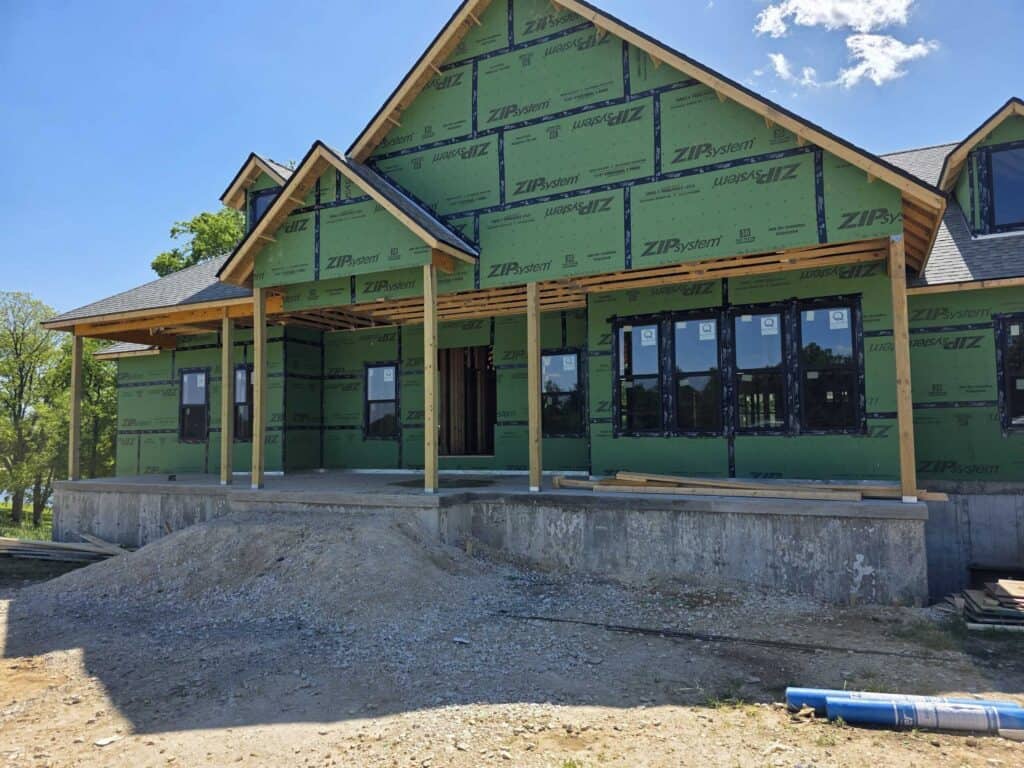 Framing underway on a custom home, part of a realistic budget for building a house in Southeast Missouri